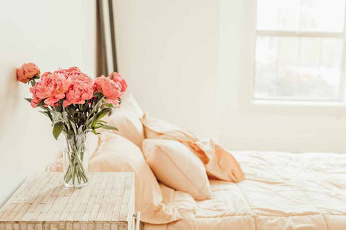 Flowers in a fresh airy bedroom